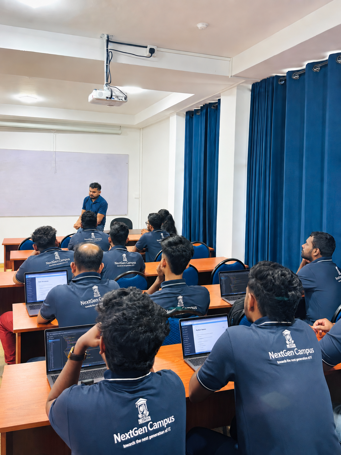 Classroom illustration of NextGen Campus students using laptops during guided learning